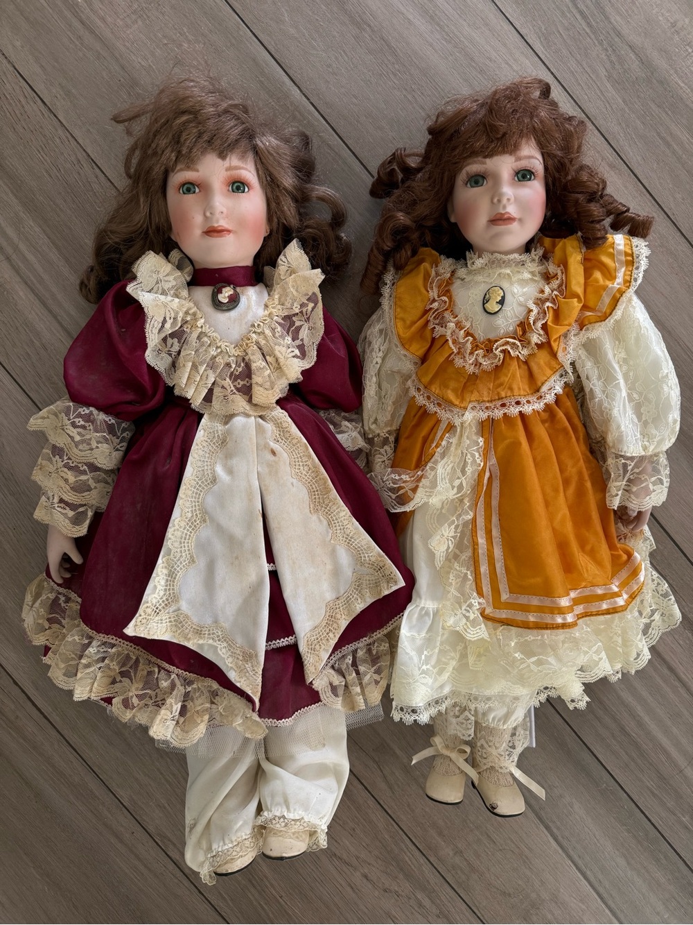 Impressions Porcelain Dolls in Burgundy and Mustard Dresses 24 inches
